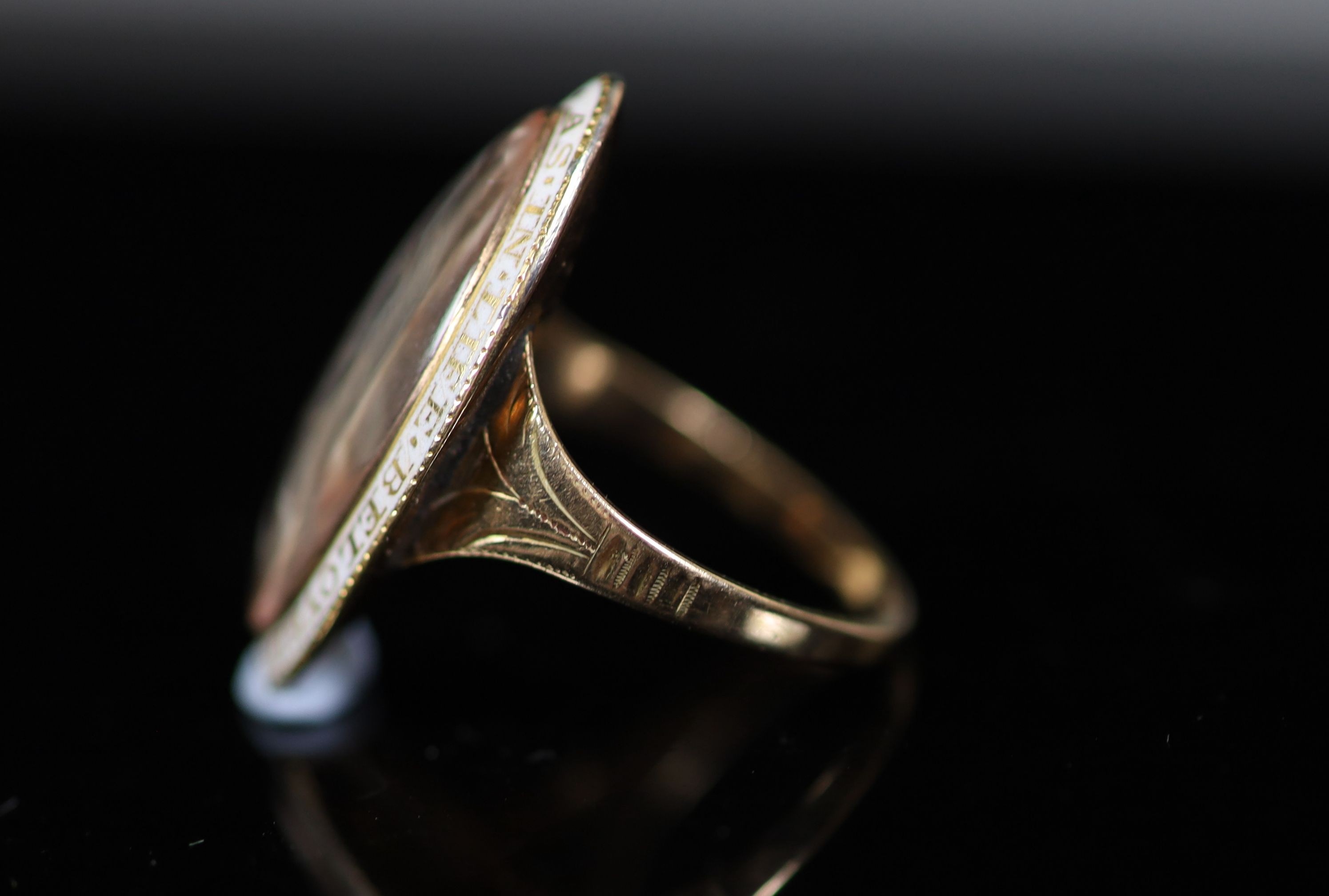 A George III enamelled gold memorial ring, inset with an ivory plaque